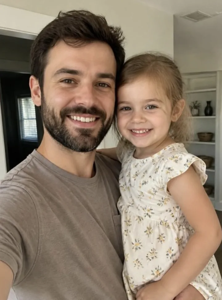 Photo of a father holding his daughter