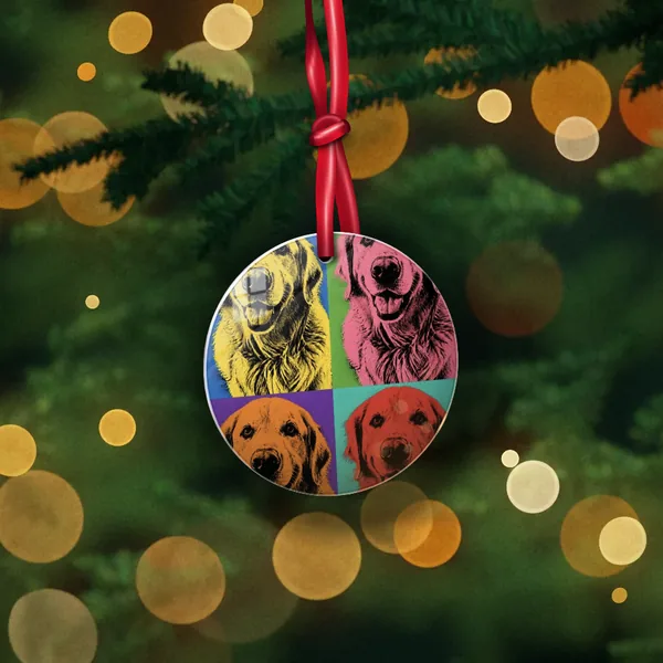Round metal ornament with a pop art dog portrait, hanging on a Christmas tree
